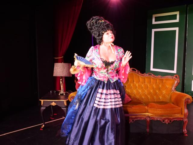 Flummoxed lady on stage in costume